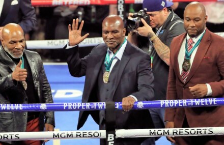 Mike Tyson showcases his power in wrestling ring while he waits for Evander Holyfield fight